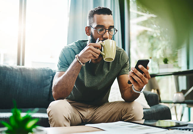 Man reviewing HR data on phone